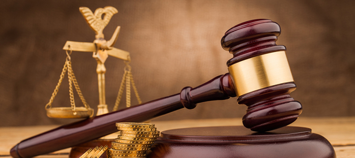 judge gavel with money  and scales closeup